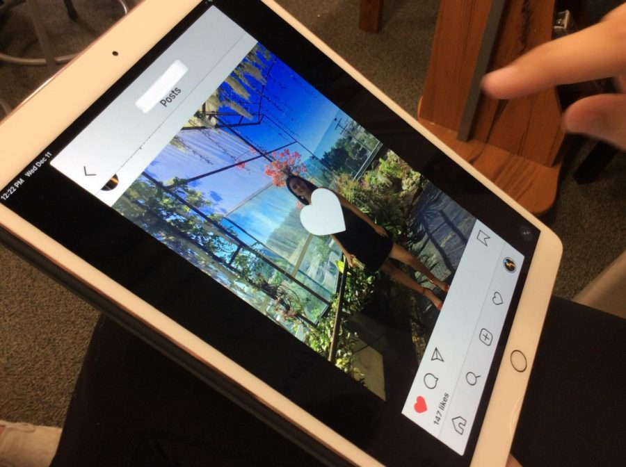An MBMS student likes a photo on Instagram.