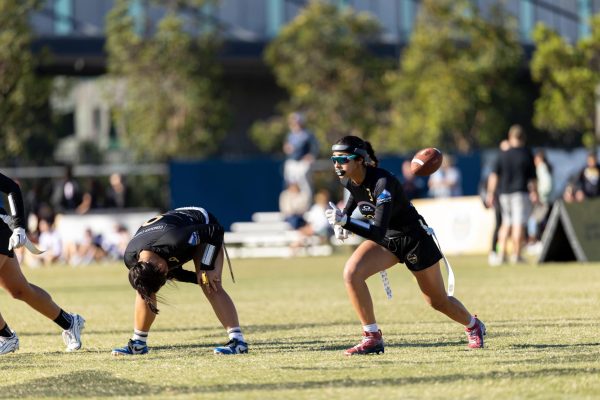 As the ball is snapped, Sophie starts running her route to execute a successful play.